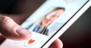 A person using a dating app on their smarpthone
